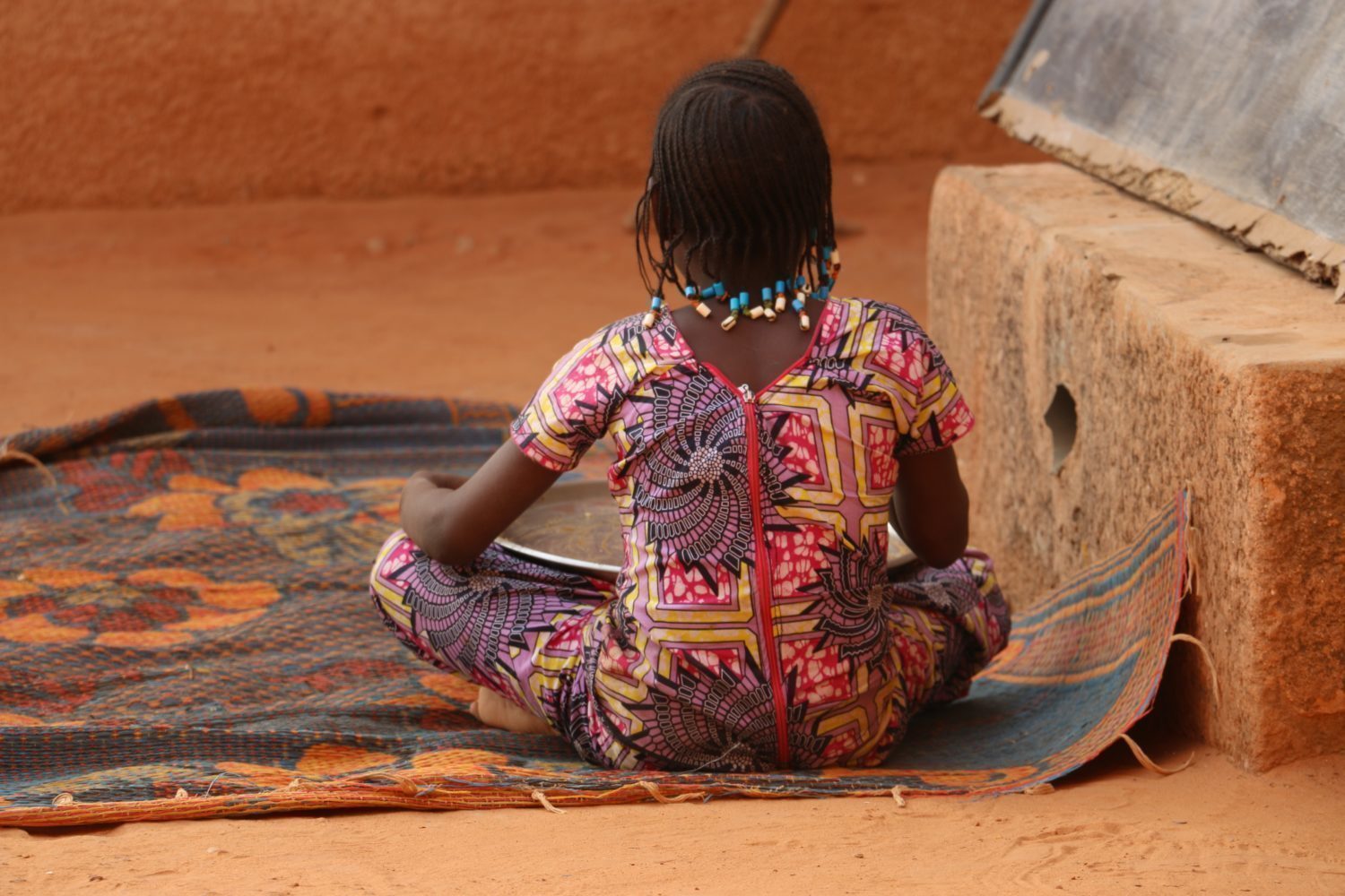 Girl sitting on ground